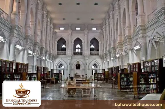 Long main reading hall of Bahawalpur Central Library with study tables